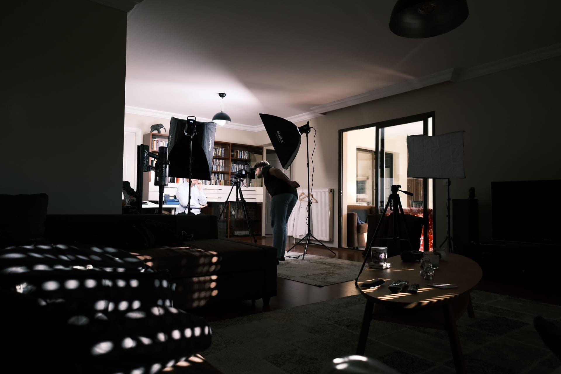 A softbox video light on a stand in a studio